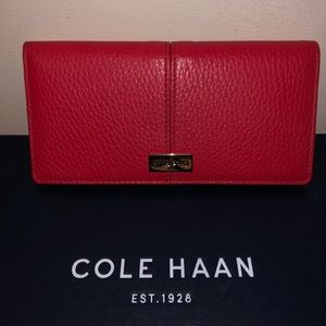 Like new cherry red Cole Haan wallet.